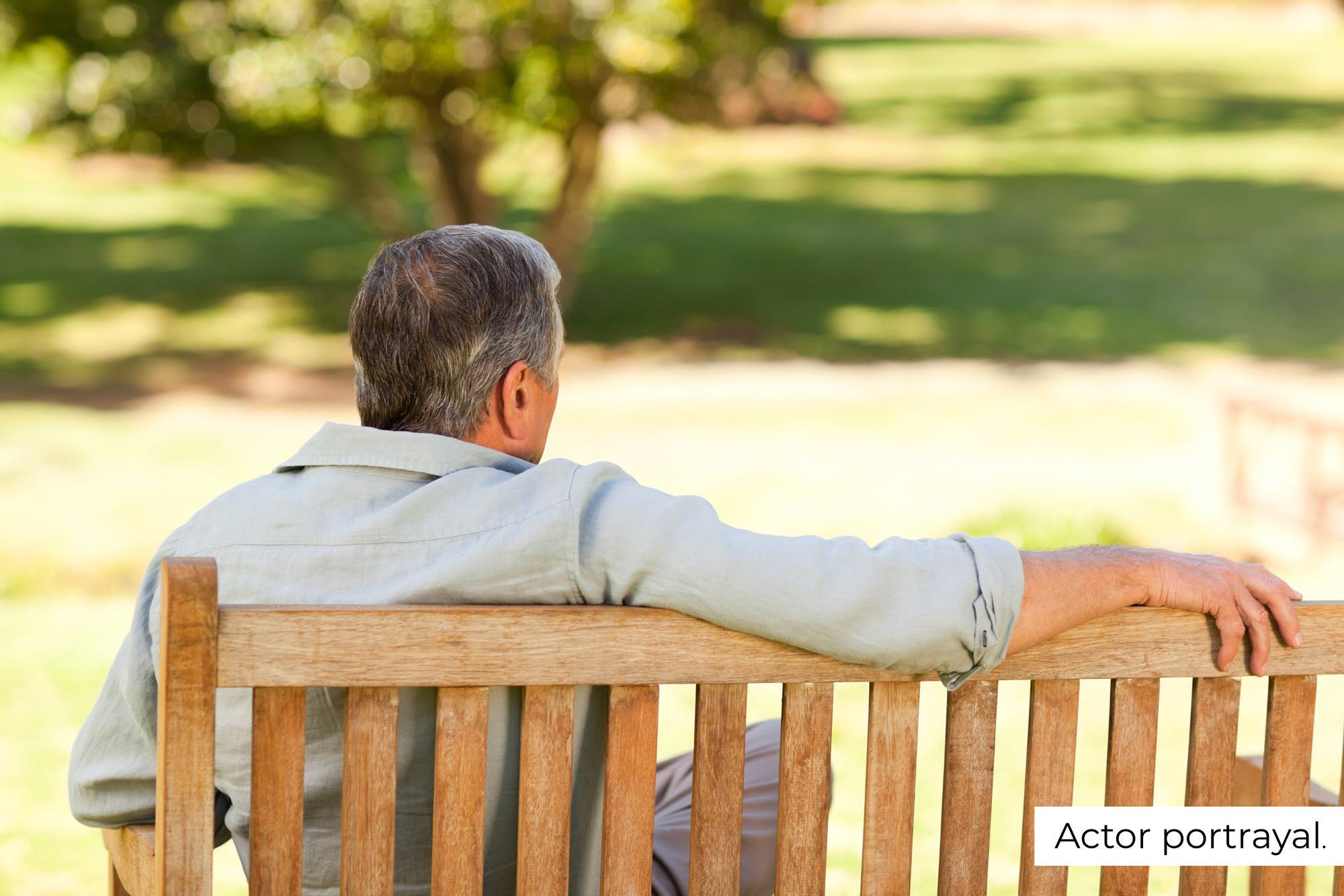 man sitting on park bench